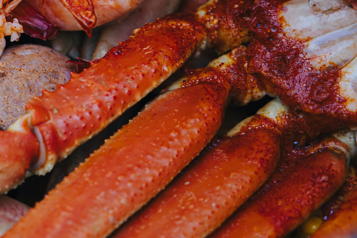 Crab legs coated in spicy cajun seasoning