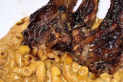 Grilled lamb chops over creamy rasta pasta