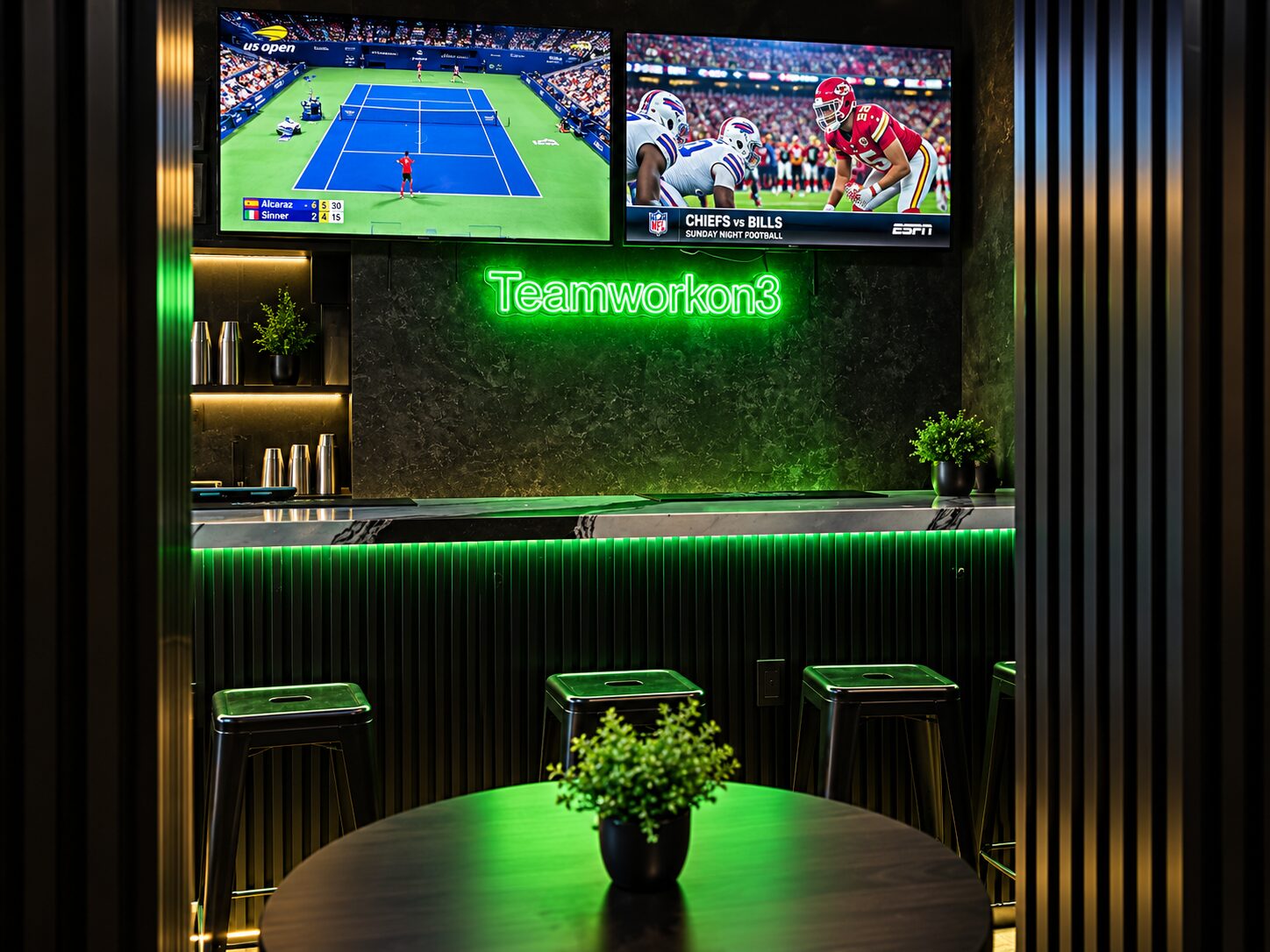 The bar under the green Teamworkon3 neon, two screens showing live sport above it, stools at the counter