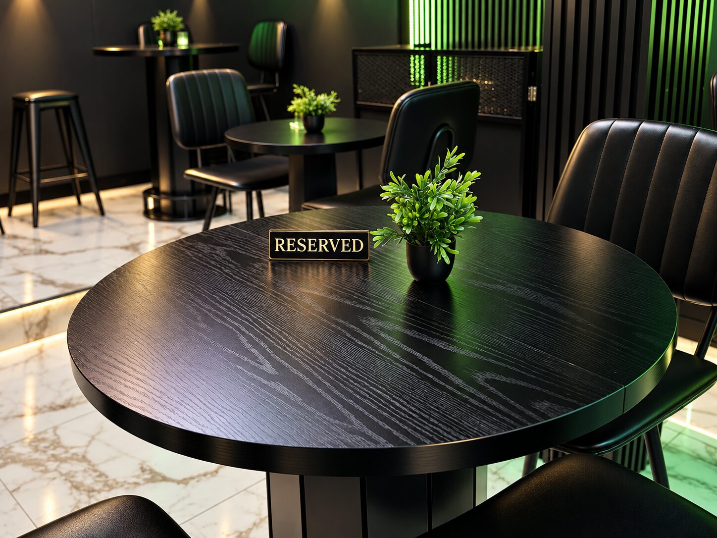 A reserved sign on a black table set for service, the room beyond